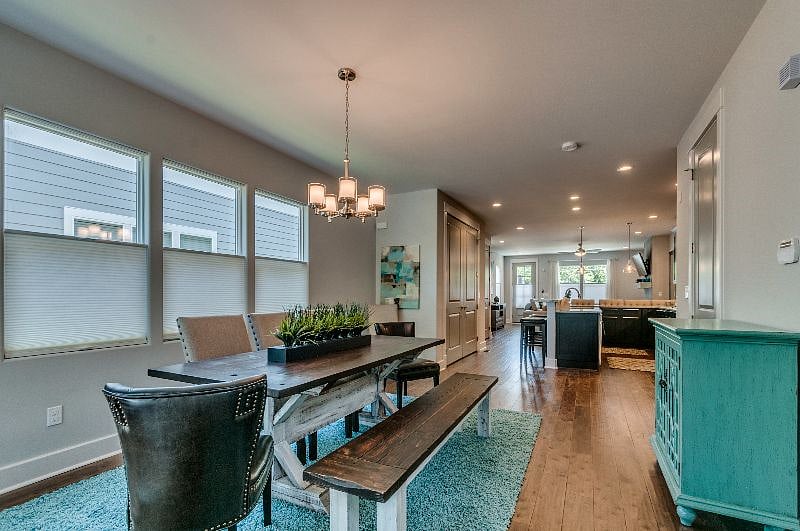 Dining room with top down, bottoms up cellular blinds. 