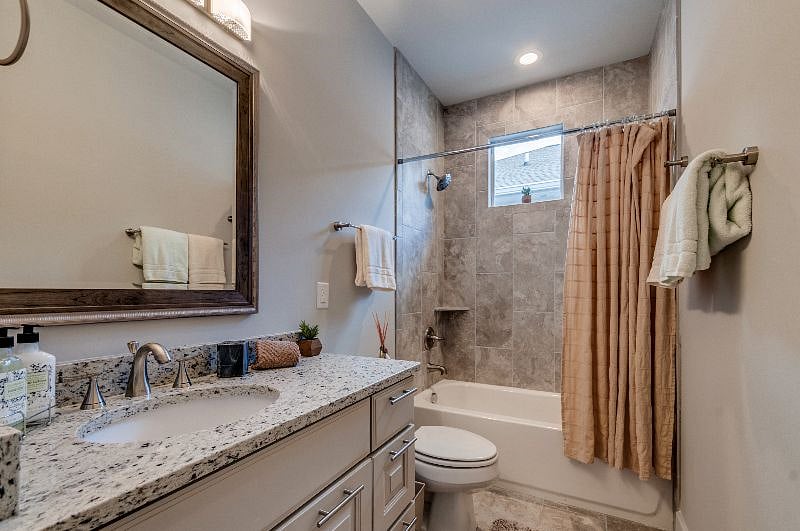 Large second bath with tub. Plenty of bathroom storage