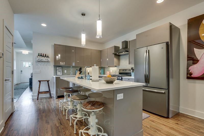 The Urban Oasis Beautiful designer Chef's kitchen with all of the Amenities & Kitchen island that seats 4. 