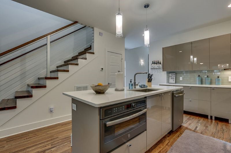 Designer Chefs Kitchen with large island and a convection oven. 