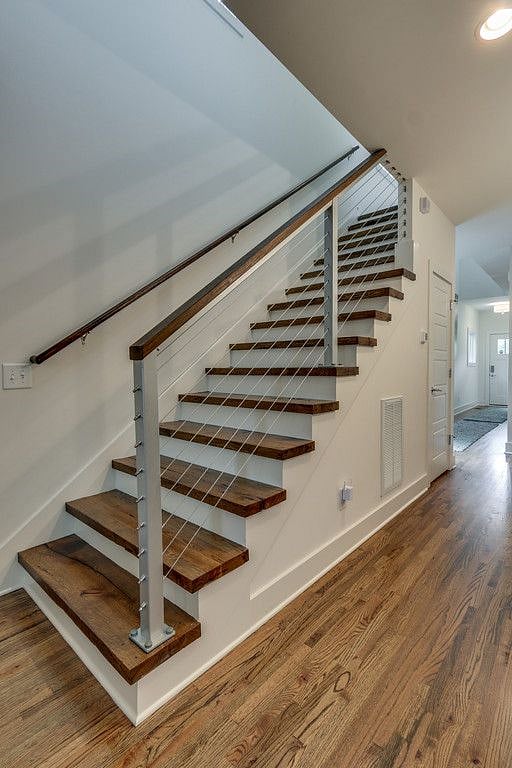 Custom cedar stairwell with industrial medal railing 