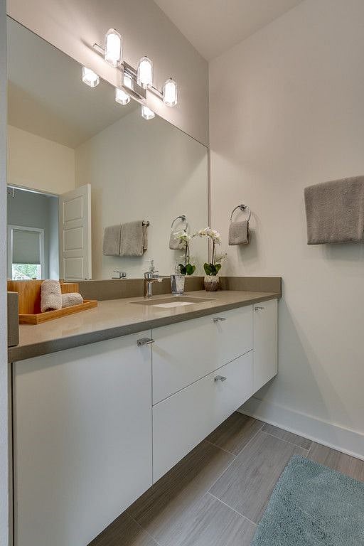Upstairs 2nd BedRoom En-suite Full Bath with quartz counter tops and soft touch cabinets