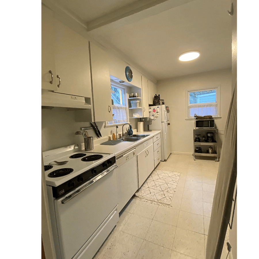 Fully outfitted kitchen including dishwasher, microwave, coffee maker and ample storage.