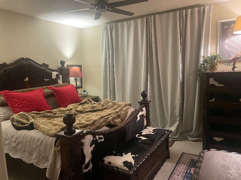 Master bedroom with attached bathroom and walk in closet, double vanities. King bed.attached patio with sliding glass door.