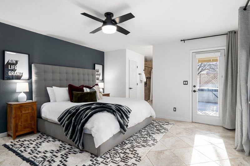 Main Bedroom with King Bed and attached bathroom. Direct access to back patio and hot tub. 