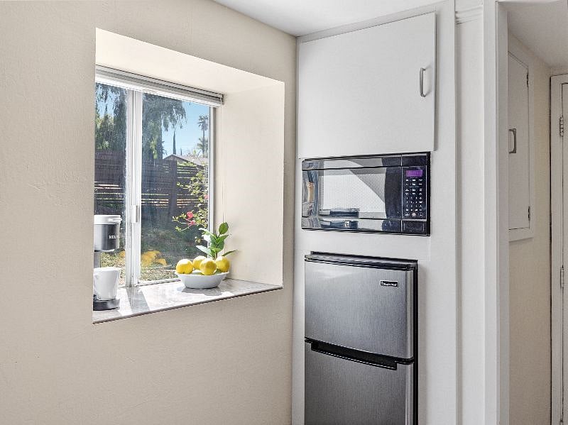 Compact refrigerator, freezer and microwave.