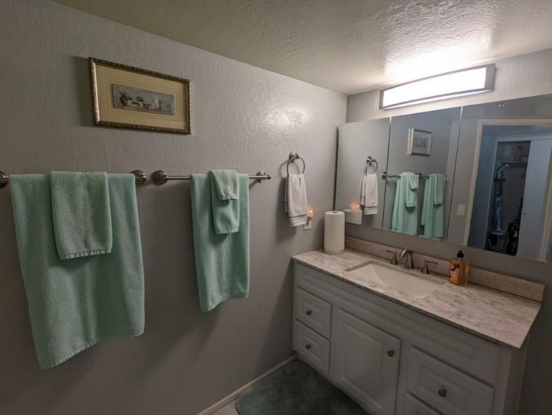 Large Bathroom With Granite Countertop