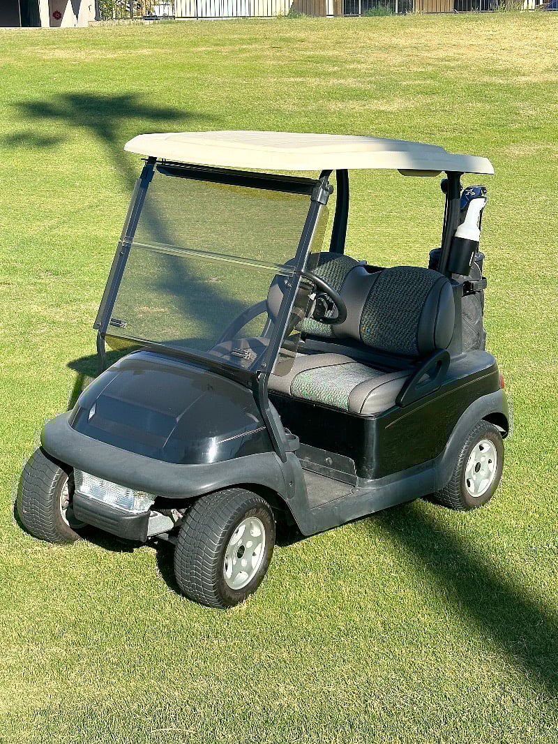 Two seater golf cart included.
