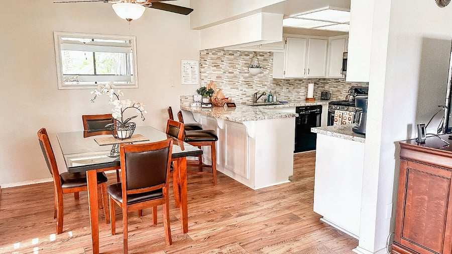 Our dining room sits just off the kitchen, offering a cozy and convenient space for everyday meals and gatherings.