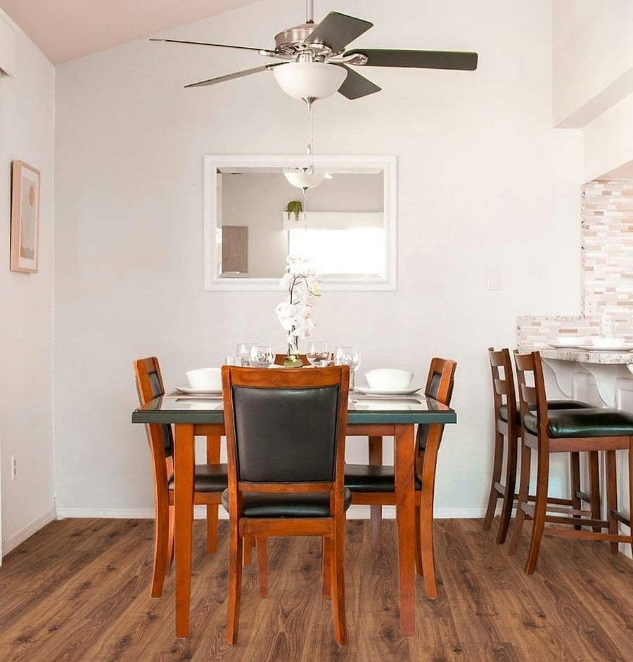 The main table comfortably seats four, while the nearby counter provides two additional spotsperfect for casual dining or keeping the cook company.
