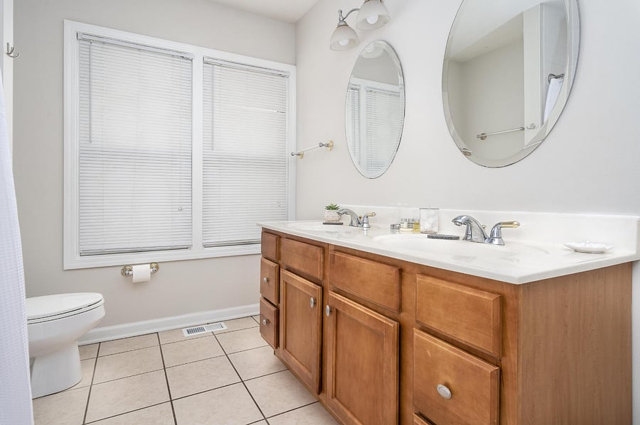 Unit B with private jetted tub and dual sinks located off the hallway (not en suite, but private)