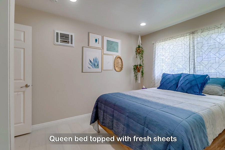 Wake up to a bright & refreshing morning on your comfy queen bed in Bedroom 