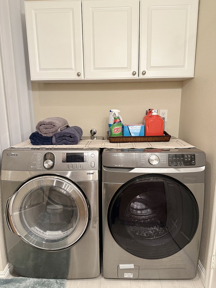 Laundry days are made easier with a washer & dryer in this nook