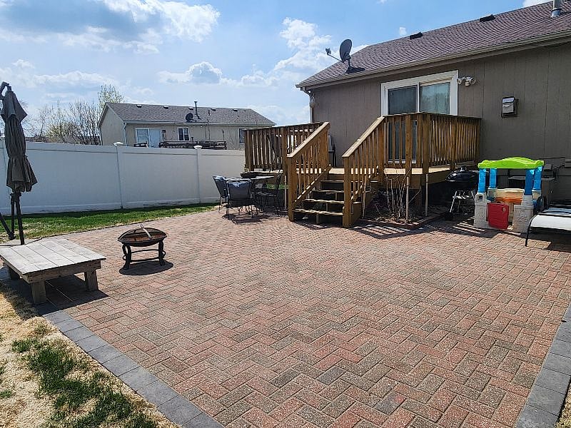New patio with patio table, 4 chairs and firepit.