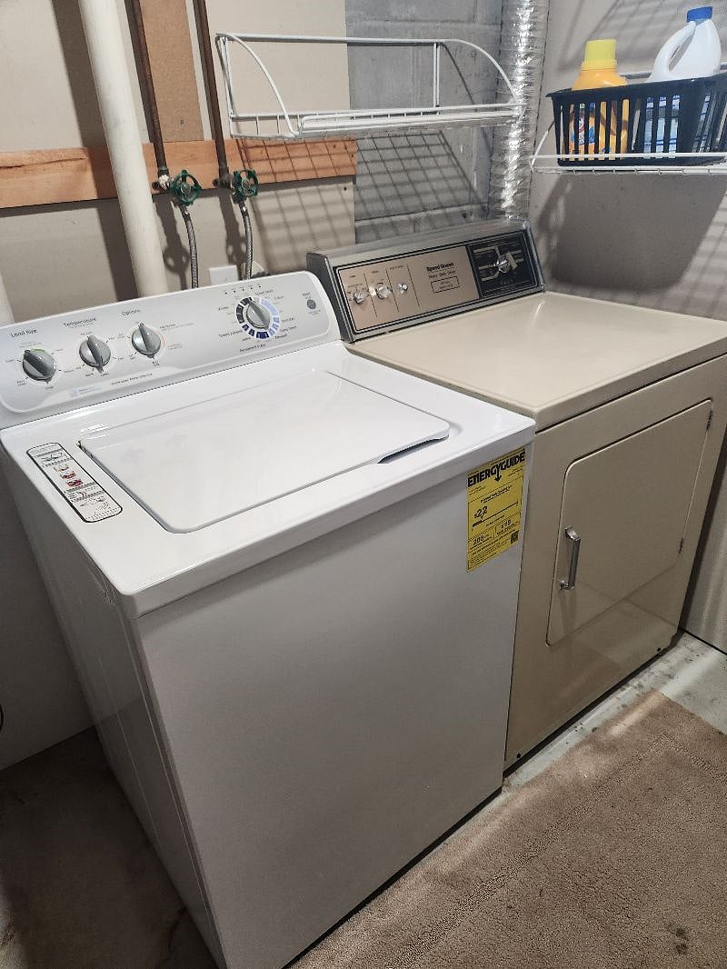 wash and dryer in basement. Plenty of shelving and hanging racks.