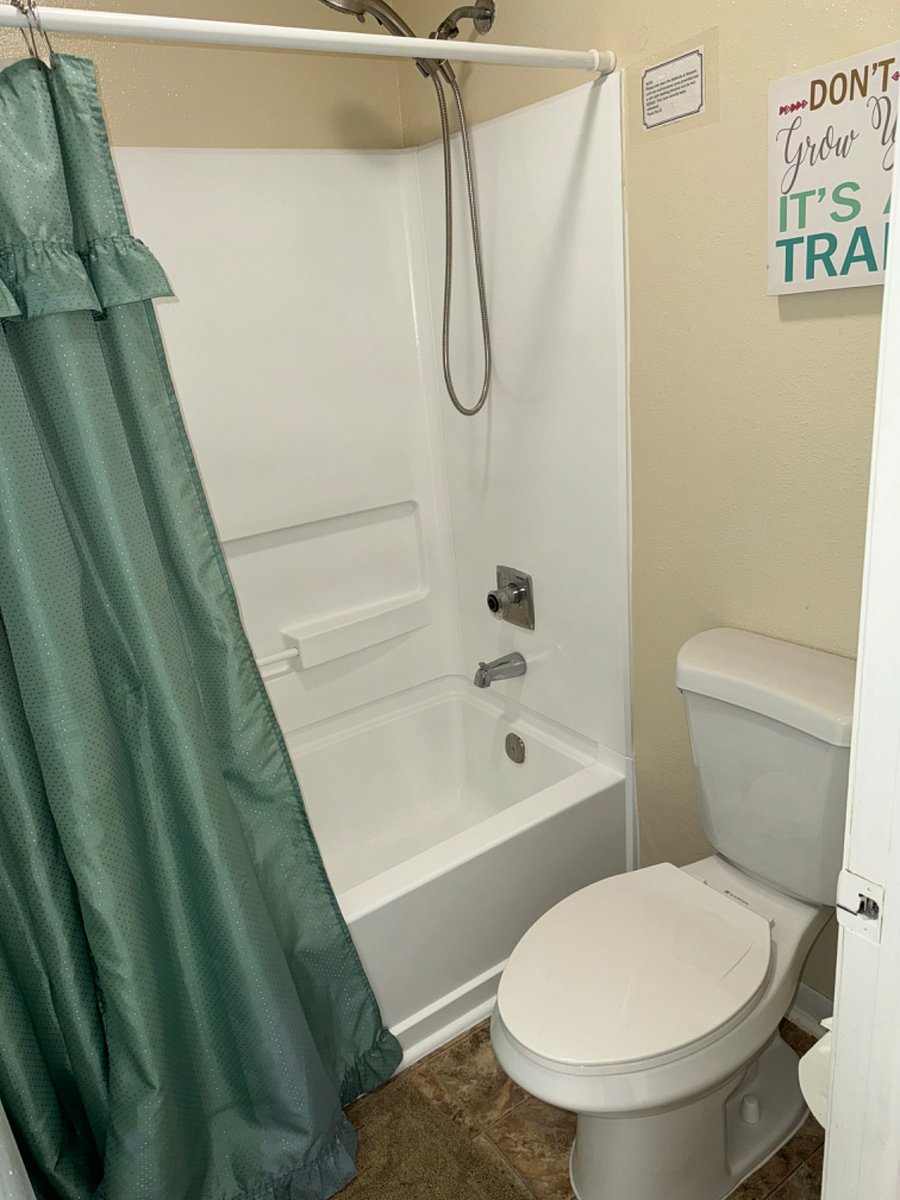 2nd bathroom (tub/shower) & toilet with separate locking door from dressing area.  