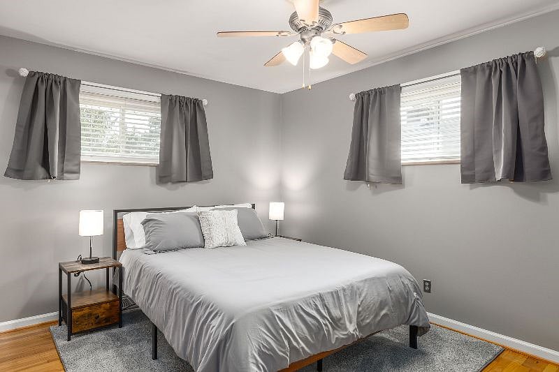 Primary bedroom that has queen size bed with memory foam mattress, full size dresser with mirror attached and access to full bathroom. Blackout curtains perfect for those who work night shift!