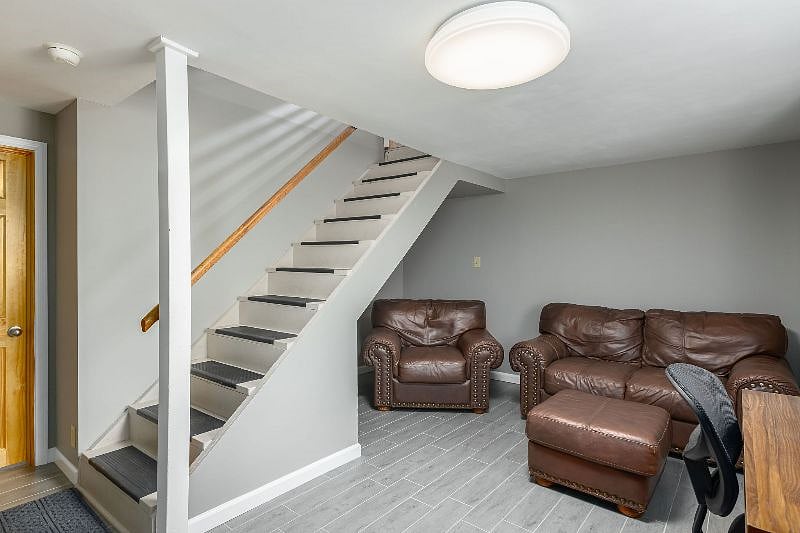 Lower level sitting area with access to garage, laundry room and workout area.