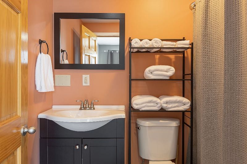 Lower level full bathroom with combined tub/shower.