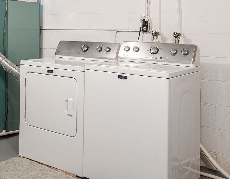 Lower level laundry room includes full size washer and dryer.