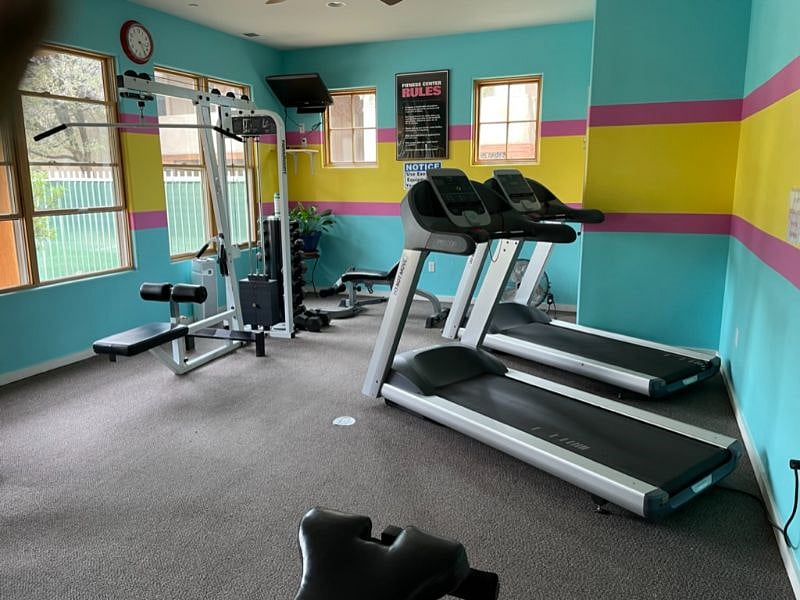 Community gym with weights, two treadmills, bike and elliptical.