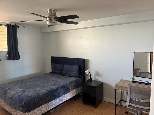 Mountain bedroom with new ceiling fan-light.