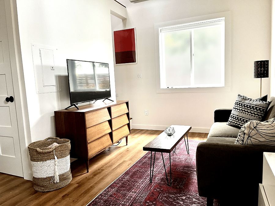 Living room with smart TV and Chromecast, frosted window