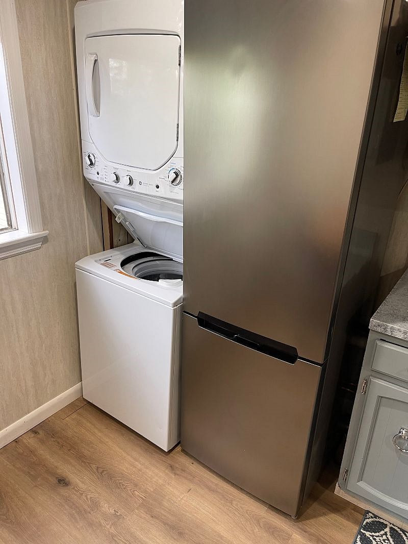 Washer/Dryer and Fridge in Kitchen.
