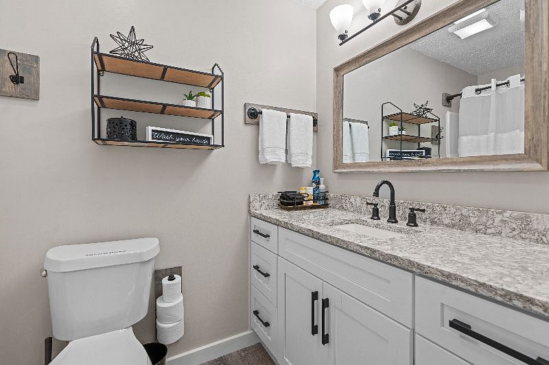 Master bath with Cambria Quartz countertop. Full size tub/shower.