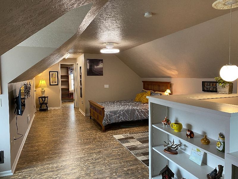  In the alcove at the end of the room you can see the doors for bathroom, custom walk in closet, and second large walk in storage closet. 