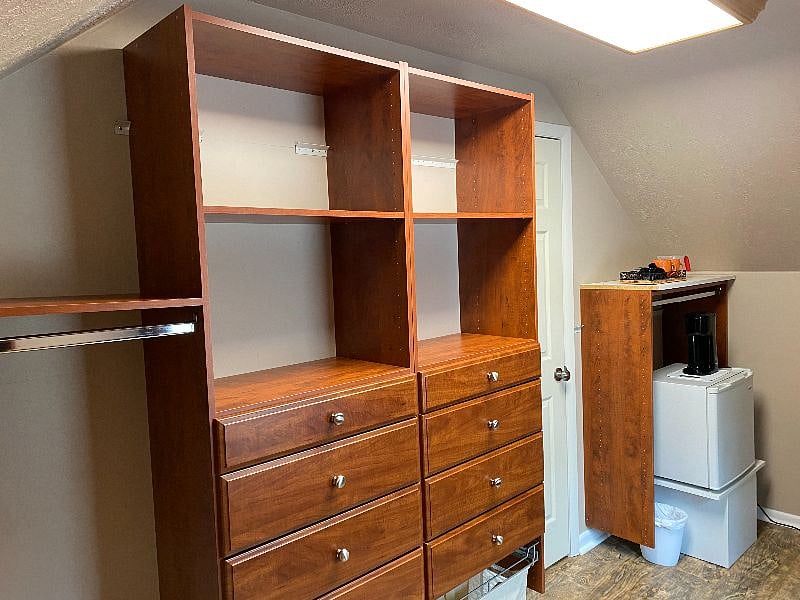Custom walk in closet with ample space for your hanging and drawer storage.