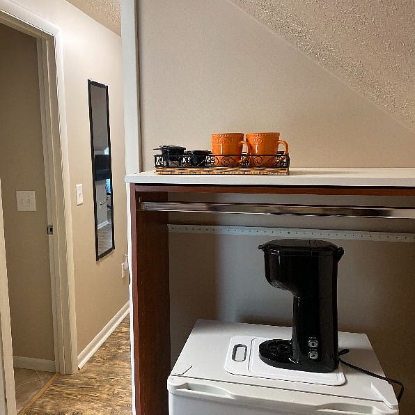 Mini refrigerator and dual pod/grounds coffee maker so you can get that first or last cup of the day and snack in total privacy.