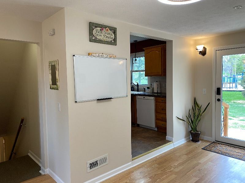 Shared breezeway leads to the  kitchen and the main floor of the home and to lower level laundry and Suite 3.  