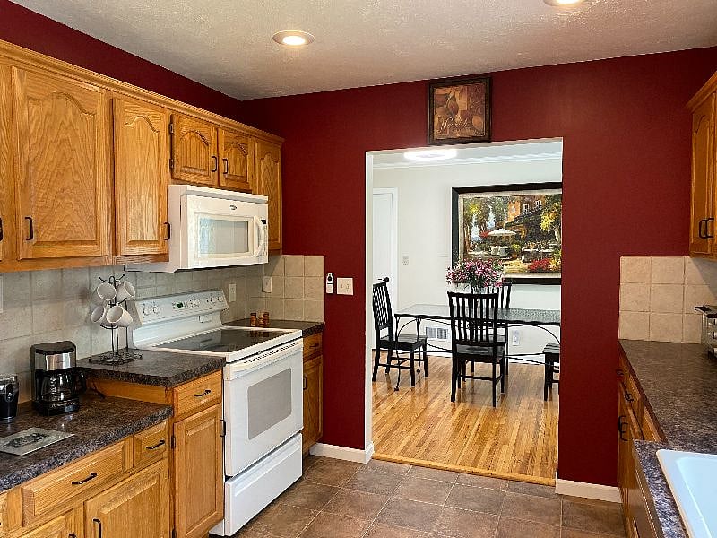 Shared kitchen with view to dining room. You will have dedicated drawer and  upper and  lower cabinet space.