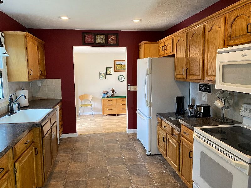 Spacious shared kitchen with view to breezeway.  You will have dedicated shelf space in the refrigerator.  You also have a small refrigerator in your suite.