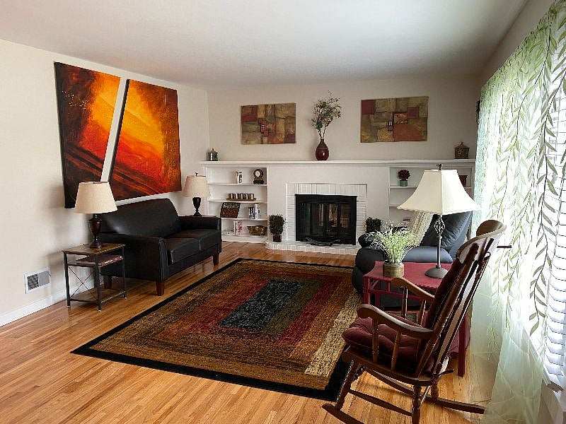 Shared living room.  The fireplace is non operational for everyone's safety.  Feel free to borrow the books.