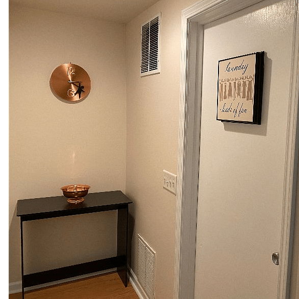 Entrance to the laundry room.  Washer, dryer, wash sink, full sized ironing board, steamer and laundry supplies provided.