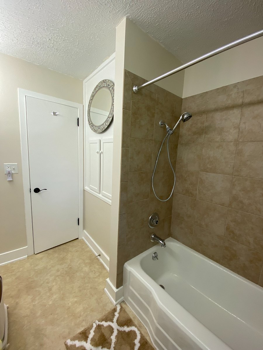 Tub/Shower combination and bathroom storage.