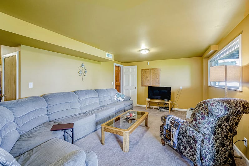 LARGE sectional with pullout double hide-a-bed. Large screen with full cable and wifi (video games too).
