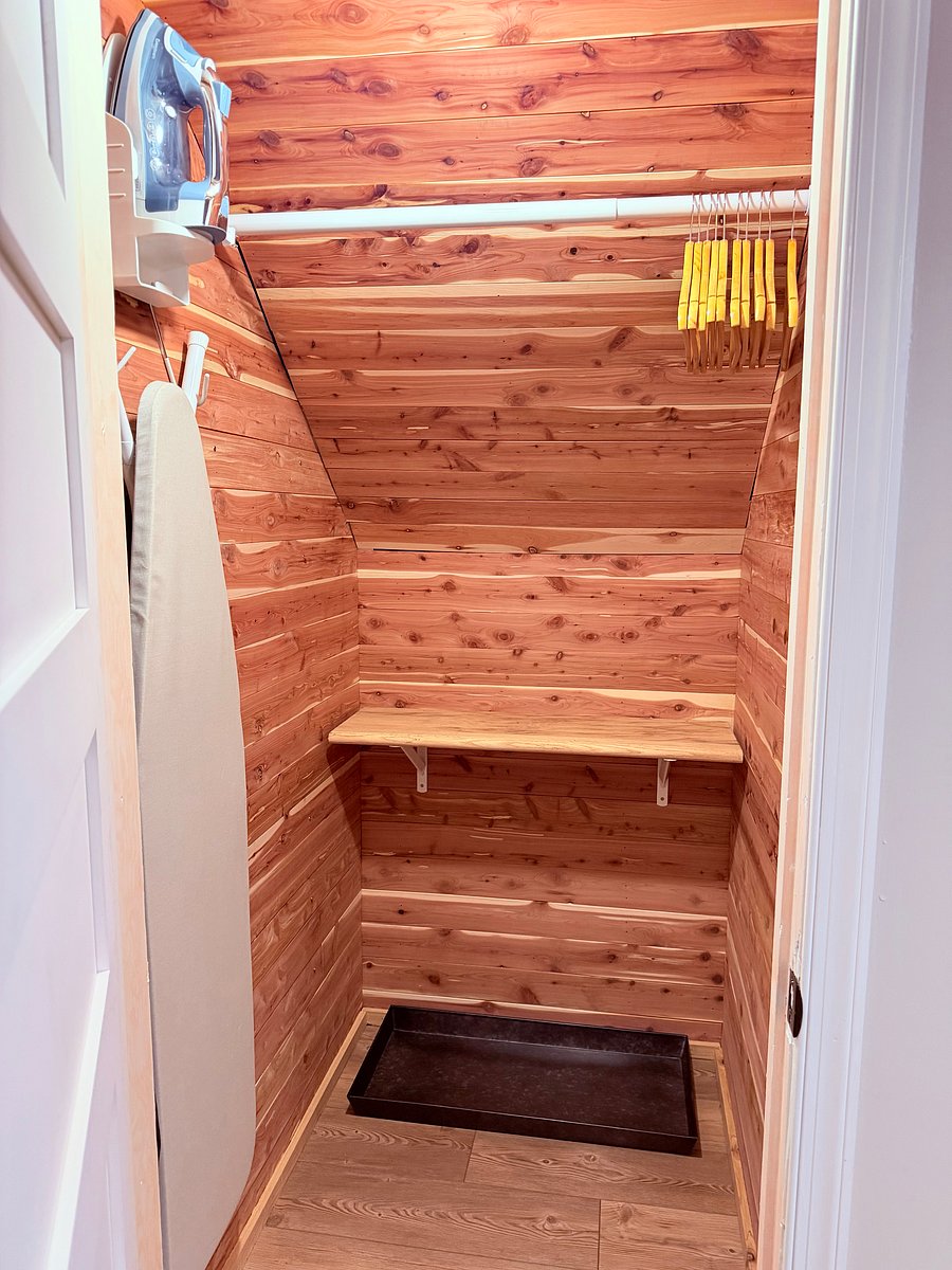 Cedar-lined closet with boot tray & ironing board/iron