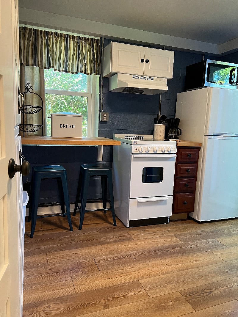 Kitchen with all new appliances and floors, and a place to eat