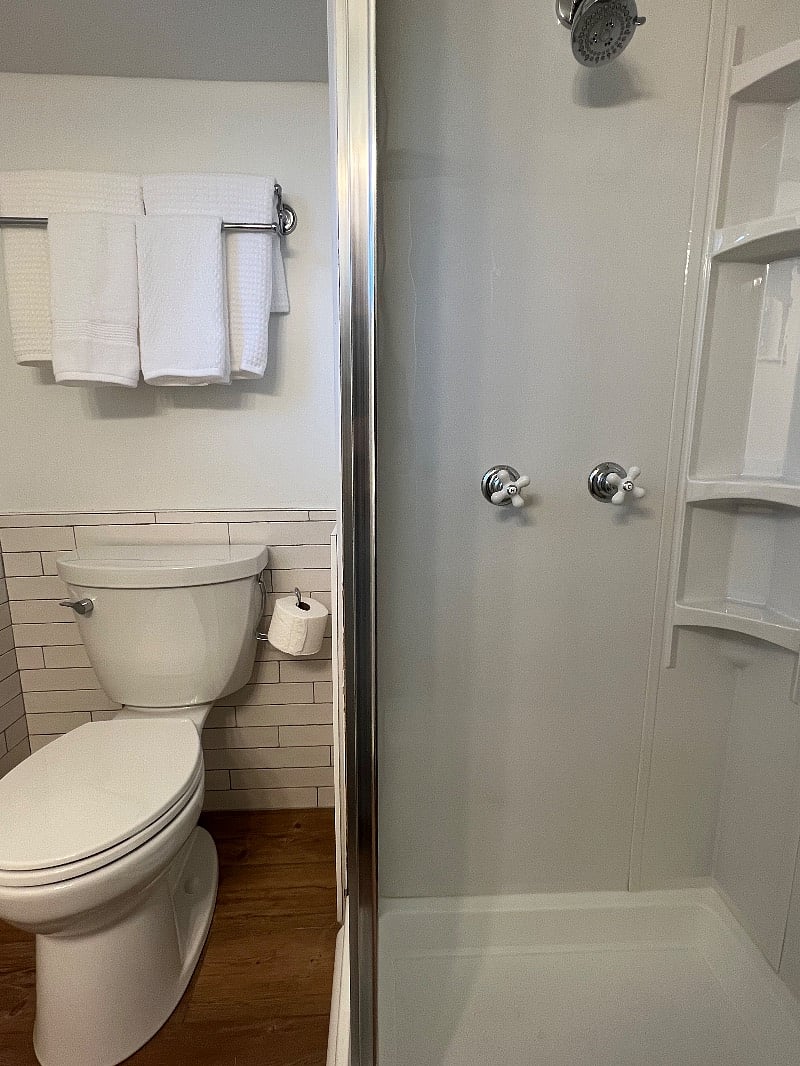 Full bath w/ new shower, toilet, hardware, and floors. Linens provided.