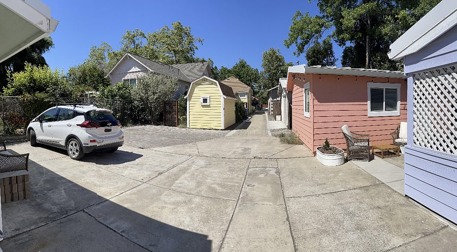 Shared driveway, with dedicated parking space in front of unit