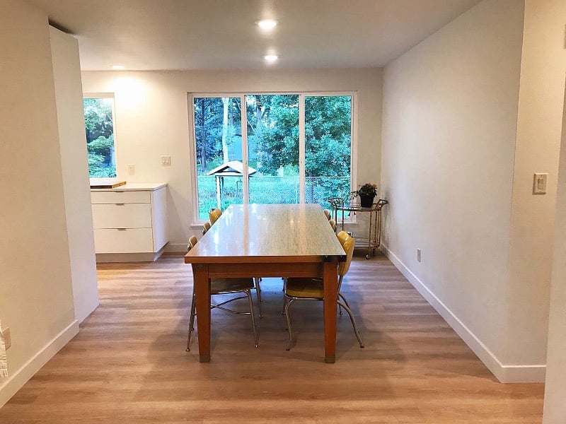The large window offers a beautiful view of the garden and park from the dining room.