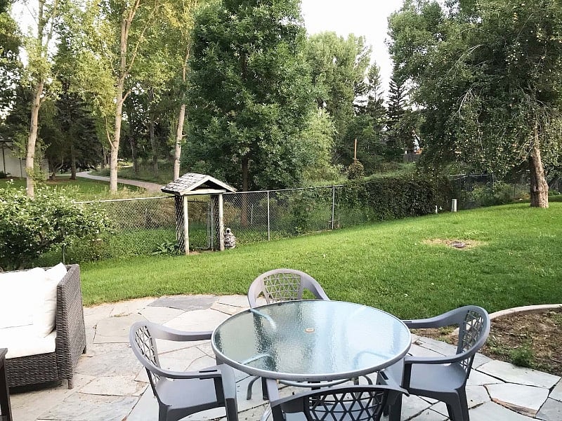 dine al fresco with a view of Rolland Moore Park and Spring Creek Trail