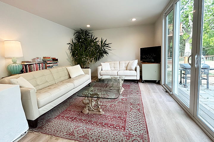 Enjoy the beautiful park views from the leather sofa and love seat in the family room