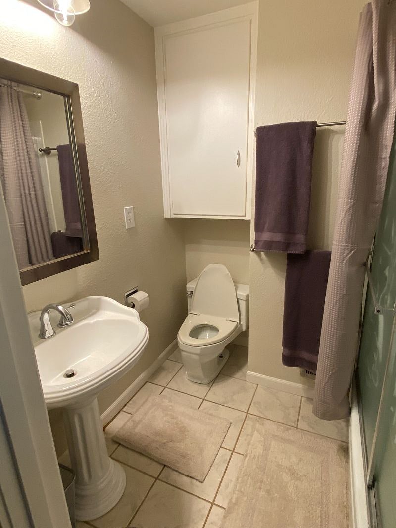 The house has 3 bathrooms, so this one is truly JUST yours. It adjoins your room. Both are off the beaten path of the house, and also right by the front door, so you have essentially private in and out. 