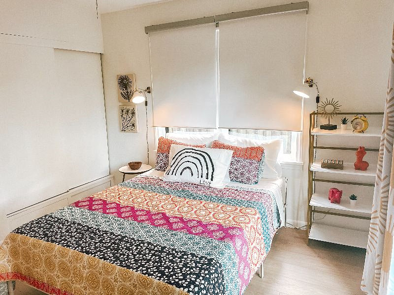 Queen bedroom includes Casper mattress, room darkening shades and drapes, sound machine, and sliding doors to backyard.
