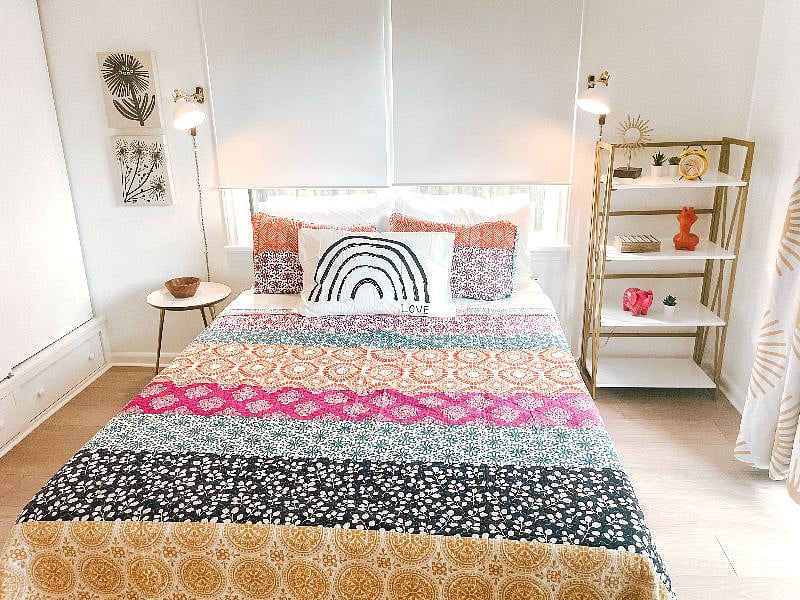 Queen bedroom includes Casper mattress, room darkening shades and drapes, sound machine, and sliding doors to backyard.