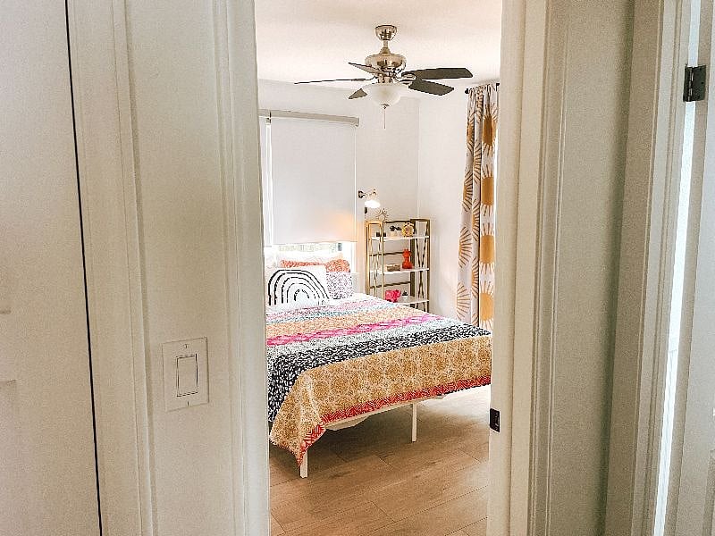 Queen bedroom includes Casper mattress, room darkening shades and drapes, sound machine, and sliding doors to backyard.